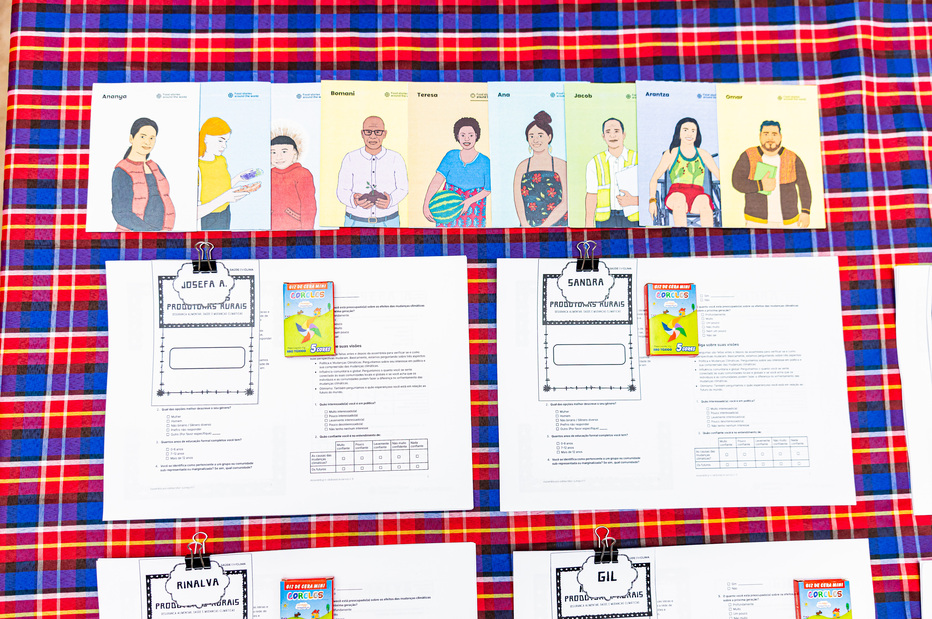 A set of activity cards and worksheets laid out on a checked cloth